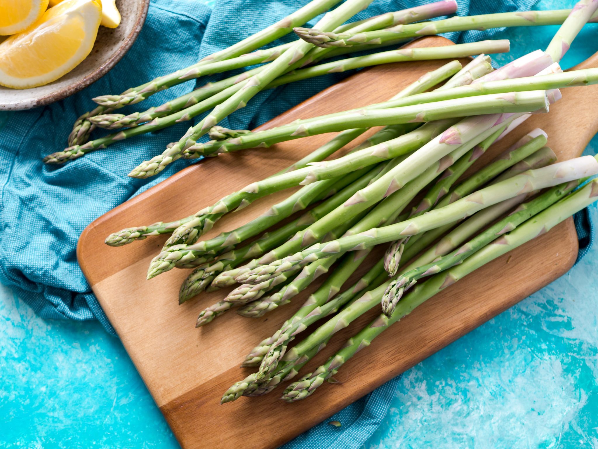 Fresh asparagus on a chopping board