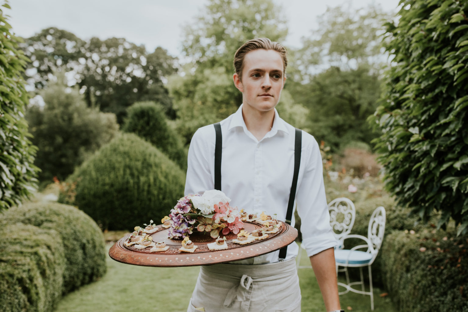 Ross and Ross waiter serving canapés at a corporate event