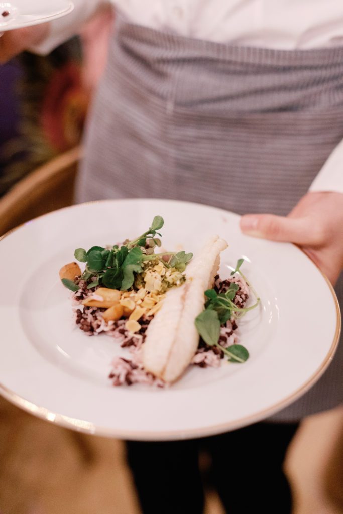 High end event food served on a white ceramic plate