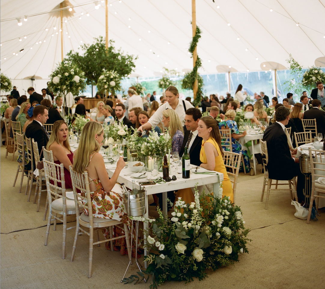 Ross and Ross wedding catering team serving guests at marquee wedding in the Cotswolds.