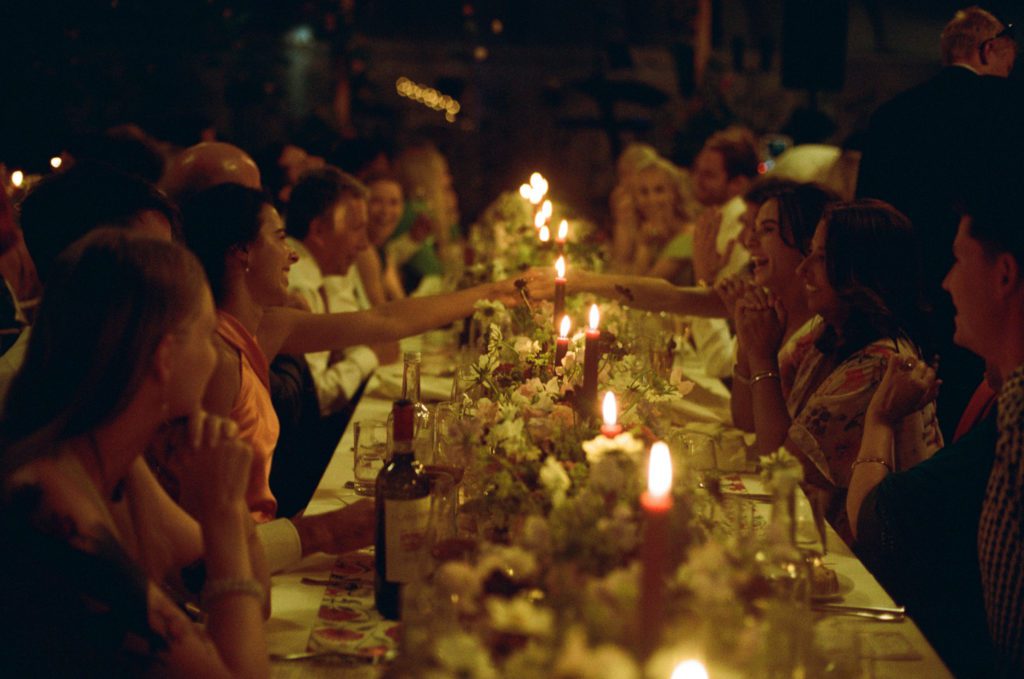 Guests enjoying their food at a private dinner party
