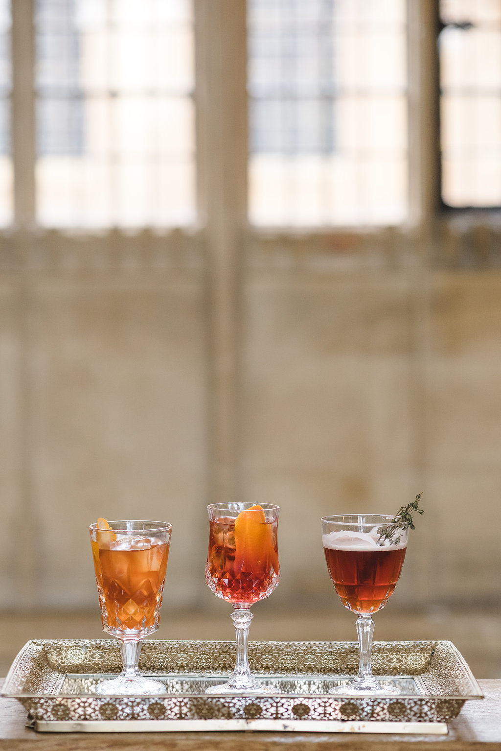 Signature cocktails served on a tray at a private event